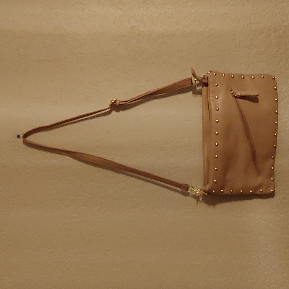 A Charming Charlie beige medium purse, used, but on good condition.